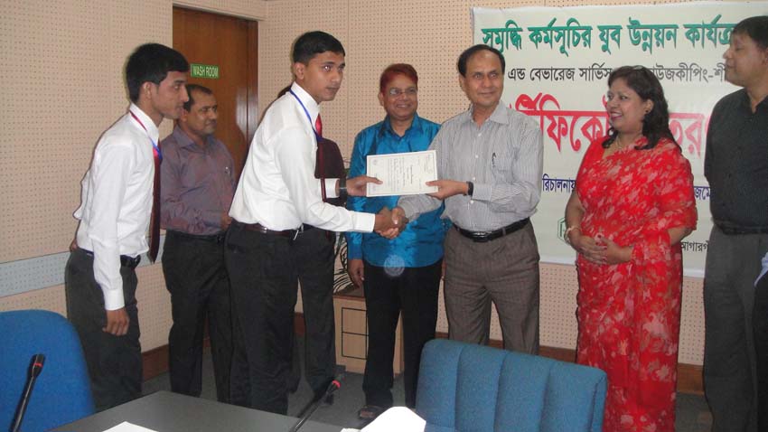 Md. Abdul Karim, MD of PKSF, handing over certificate to an ENRICH training participant