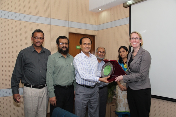 Managing Director of PKSF presents crest to Ms. Sarah Cooke, Country Representative of DFID Bangladesh