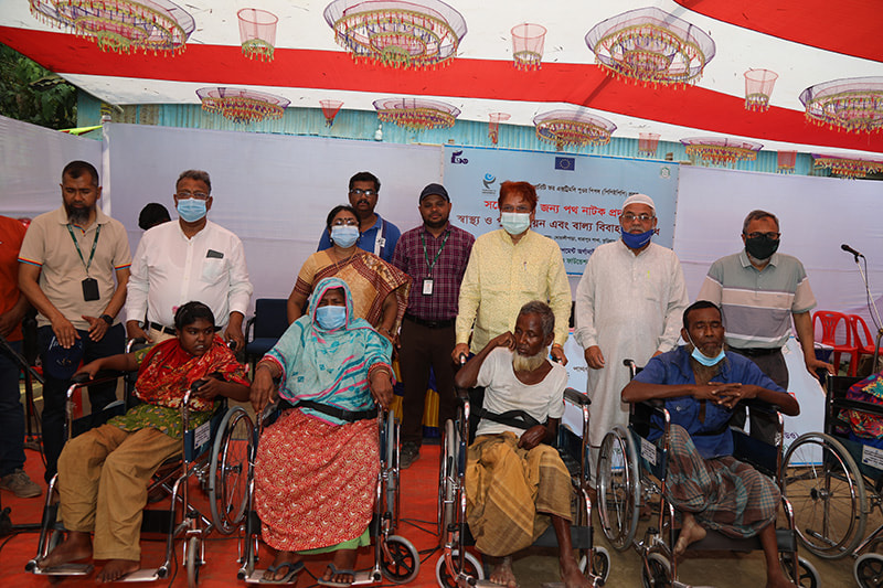 The PKSF Managing Director distributes assistive equipment among persons with disabilities in Kurigram Sadar.