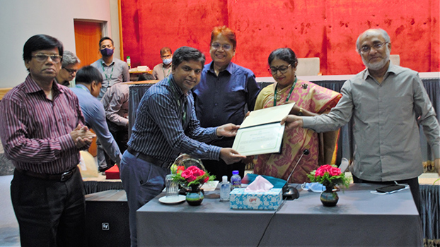 The Integrity Award 2021-22 is being handed over to Md Ashraf Hossain,Manager (Human Resources)